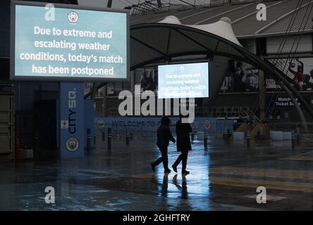 Workers leave after the Premier League match between Manchester City and West Ham United was postponed because of weather conditions at the Etihad Stadium, Manchester. Picture date: 9th February 2020. Picture credit should read: Darren Staples/Sportimage via PA Images Stock Photo