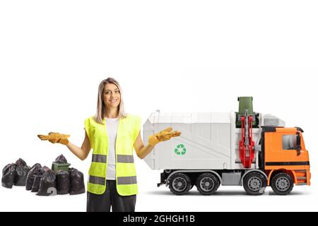 Female waste collector and a garbage truck in the back isolated on white background Stock Photo