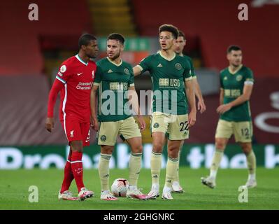 Liverpool's Georginio Wijnaldum argues with Sheffield United's George Baldock during the Premier League match at Anfield, Liverpool. Picture date: 24th October 2020. Picture credit should read: Simon Bellis/Sportimage via PA Images Stock Photo