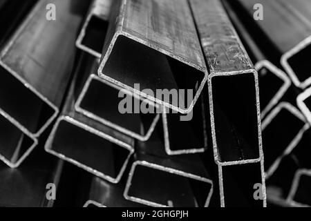 Metal pipes made of rectangular profile in a commercial warehouse Stock Photo