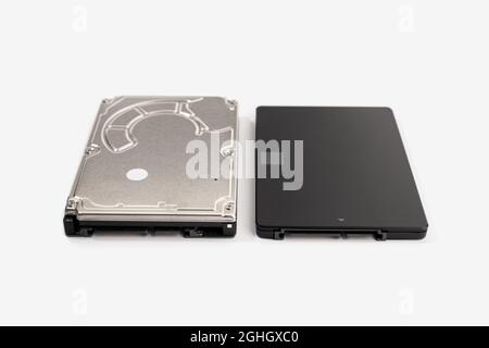 Modern SSD and old HDD Hard disk drive isolated on white background. Computer hardware data storage Stock Photo