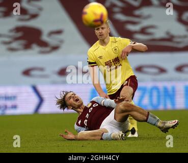 Jack Grealish of Aston Villa gets tackled by Ben Mee of Burnley during the Premier League match at Villa Park, Birmingham. Picture date: 17th December 2020. Picture credit should read: Darren Staples/Sportimage via PA Images