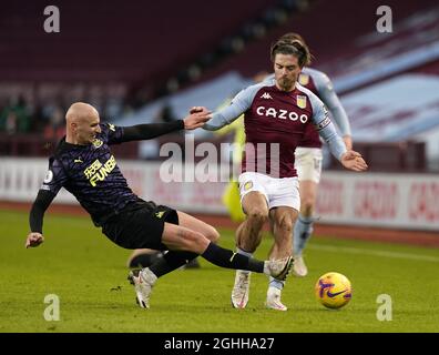 Jack Grealish of Aston Villa gets tackled by Jonjo Shelvey of Newcastle United during the Premier League match at Villa Park, Birmingham. Picture date: 23rd January 2021. Picture credit should read: Andrew Yates/Sportimage via PA Images