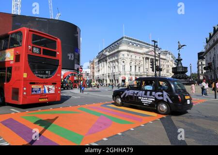 The Picadilly Art Takeover in Piccadilly Circus in summer 2021, with colourful pedestrian crossings, in London, UK Stock Photo