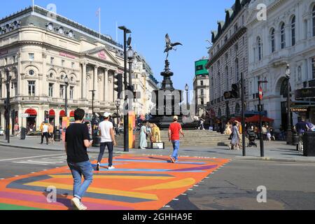 The Picadilly Art Takeover in Piccadilly Circus in summer 2021, with colourful pedestrian crossings, in London, UK Stock Photo