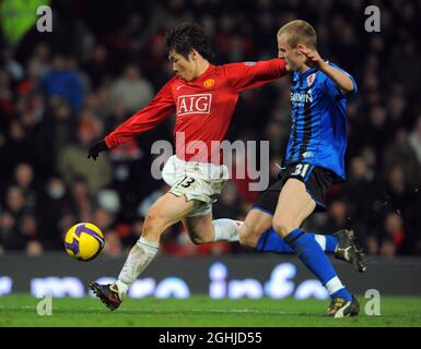 Park Ji-sung of Manchester United and David Wheater of Middlesbrough in action during the Barclays Premier League match between Manchester United v Middlesbrough in Old Trafford. Stock Photo