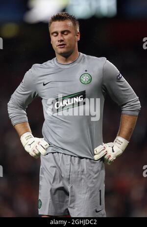 Celtic's Artur Boruc looks on dejected after the award of a dubious penalty during the UEFA Champions League Qualifying between Arsenal v Celtic in London.