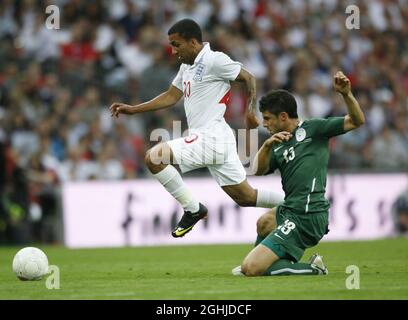 England's Aaron Lennon goes past Slovenia's Bojan Jokic during the International Friendly between England v Slovenia in London. Stock Photo