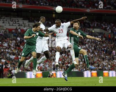 England's Jermsine Defoe and Carlton Cole tussle with Slovenia's Marko Suler and Matej Mavricrozic during the International Friendly Soccer match between England and Slovenia at Wembley Stadium, UK. Stock Photo
