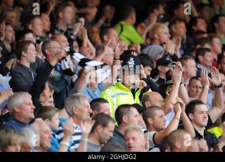 A policeman in amongst the fans during the Coca Cola Championship between Nottingham Forest and Derby County in London. Stock Photo