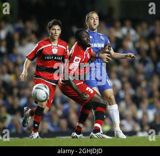 Chelsea's Joe Cole tussles with QPR's Damion Stewart during the Carling Cup match between Chelsea v QPR at Stamford Bridge. Stock Photo