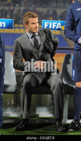 England's David Beckham takes his seat on the bench during the FIFA World Cup 2010, Group C match between England and USA at Royal Bafokeng Stadium, Rustenburg, South Africa. Stock Photo