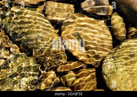 River stones at the bottom of the river l'Herbasse near Charmes sur l'Herbasse Stock Photo