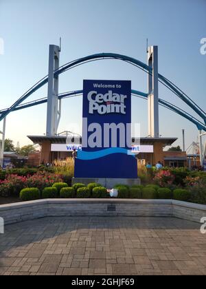 The entrance of Cedar Point with the Gatekeeper ride over the top in the evening with a sunset. Stock Photo