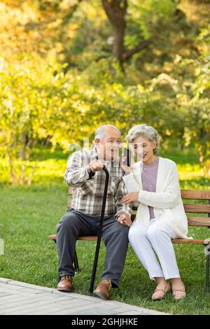Cheerful senior couple talking on the phone Stock Photo