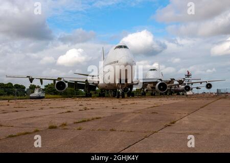 Retired Boeing 747 Jumbo jet airliner planes stored and having had items removed. Manston Airport boneyard, scrapping likely. Surplus airliners Stock Photo