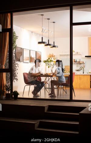 Happy young couple enjoying dinner Stock Photo