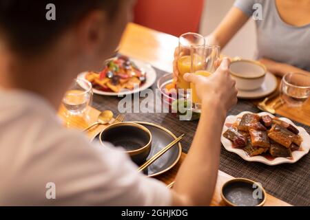 Happy young couple enjoying dinner Stock Photo