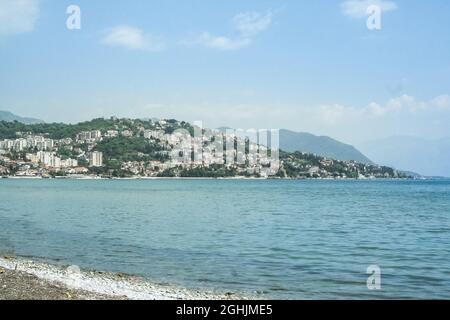 Picture of Herceg Novi, Montenegro,  seen from a beach on the adriatic sea on the foreground. Herceg Novi is a coastal town in Montenegro located at t Stock Photo