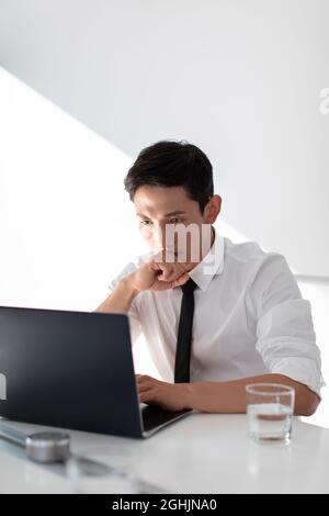 Young businessman working in office Stock Photo
