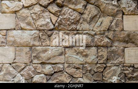 Photo of medieval wall, stone wall texture for background, lettering, Stock Photo