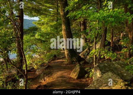 Tumbled Rocks trail around Devils Lake at sunrise. Devils Lake state ...