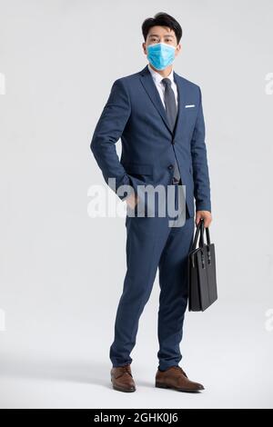 Portrait of businessman wearing surgical mask Stock Photo
