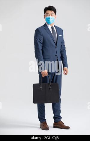 Portrait of businessman wearing surgical mask Stock Photo - Alamy