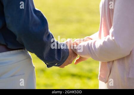 Happy senior couple holding hands Stock Photo