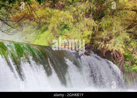 Kayaker jumping from the waterfall in Mexico Stock Photo