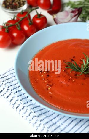 Gazpacho soup and ingredients on white background Stock Photo