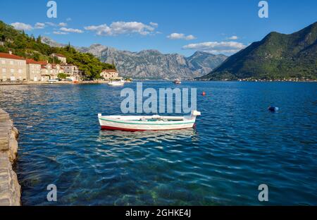 Scenic panorama view of the historic town of Perast. View across Bay of Kotor from shuttle boat. Montenegro, Europe. Stock Photo