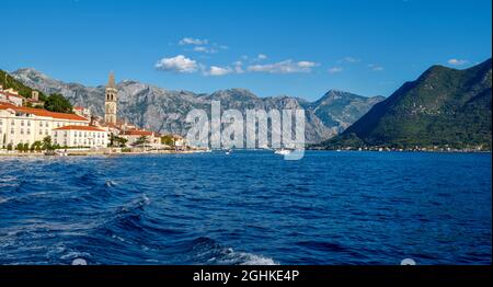 Scenic panorama view of the historic town of Perast. View across Bay of Kotor from shuttle boat. Montenegro, Europe. Stock Photo