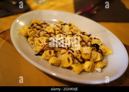 Close up Tortellini- ring-shaped pasta made from durum wheat, eggs and stuffed with meat, cheese or vegetable Stock Photo