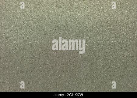 Rough texture. Wall surface. Gray background. Small crumbs of homogeneous background. Simple background of silver paint. Stock Photo