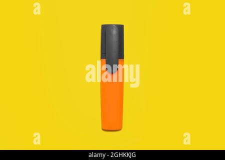 orange marker on a yellow background. office accessories Stock Photo
