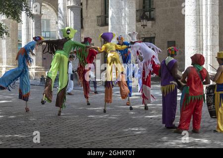 HAVANA, CUBA - May 29, 2019: A dance of stilts performed in the street Stock Photo