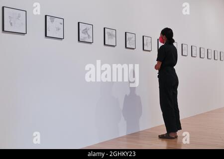 Hayward Gallery, London, UK. 07th Sep, 2021. An assistant poses with the drawings. Gerhard Richter: Drawings, 1999 - 2021 is a free HENI Project Space exhibition of Gerhard Richter's drawings, which offers a rare opportunity to explore an intimate aspect of the influential artist's practice. It runs 9 Sep - 12 Dec. Credit: Imageplotter/Alamy Live News Stock Photo