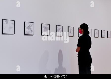 Hayward Gallery, London, UK. 07th Sep, 2021. An assistant poses with the drawings. Gerhard Richter: Drawings, 1999 - 2021 is a free HENI Project Space exhibition of Gerhard Richter's drawings, which offers a rare opportunity to explore an intimate aspect of the influential artist's practice. It runs 9 Sep - 12 Dec. Credit: Imageplotter/Alamy Live News Stock Photo