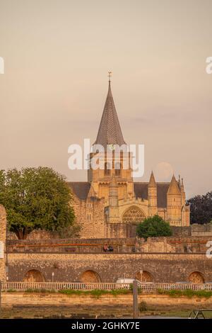 Full moon rising behind Rochester Cathedral , Rochester Kent. Stock Photo