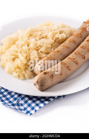 Bratwurst sausage and sauerkraut isolated on white background. Stock Photo