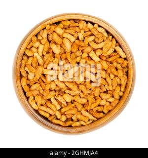Vegan minced meat, in a wooden bowl. Substitute and alternative for ground meat, based on seasoned pea protein, passed through a spiral screw mincer. Stock Photo