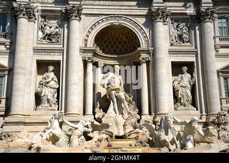 The Trevi Fountain represents Ocean on a chariot pulled by sea horses and tritons. ... The sculptor Nicola Salvi was chosen who began the work Stock Photo