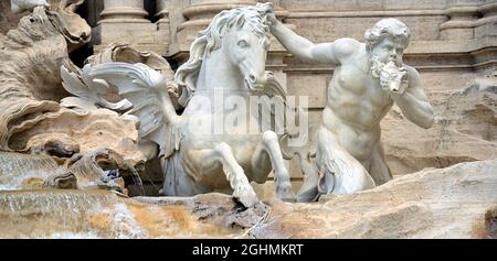 The Trevi Fountain represents Ocean on a chariot pulled by sea horses and tritons. ... The sculptor Nicola Salvi was chosen who began the work Stock Photo