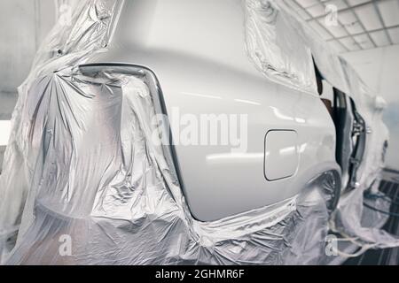 Automobile in paint-spraying booth of repair workshop Stock Photo