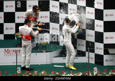 Jenson Button (GBR), McLaren Mercedes, Nico Rosberg (GER), Mercedes GP, Lewis Hamilton (GBR), McLaren Mercedes and Norbert Haug (GER), Mercedes, Motorsport chief 15.04.2012. Formula 1 World Championship, Rd 3, Chinese Grand Prix, Shanghai, China, Race Day Stock Photo