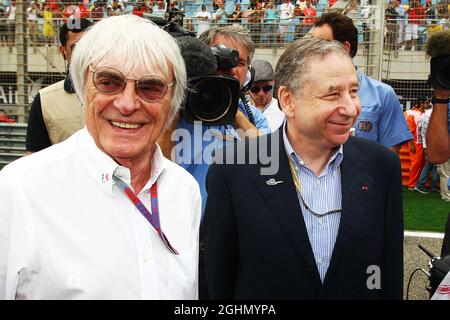 (L to R): Bernie Ecclestone (GBR) CEO Formula One Group (FOM) with Jean Todt (FRA) FIA President on the grid. Stock Photo