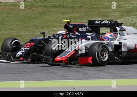 L to R): Jenson Button (GBR) McLaren with Romain Grosjean (FRA 