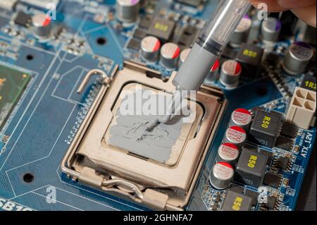 close-up Thermal compound on cpu chip in mainboard computer Stock Photo