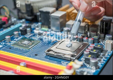 close-up Thermal compound on cpu chip in mainboard computer Stock Photo